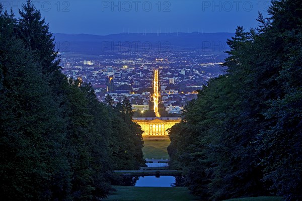 Bergpark Wilhelmshoehe with the view over the central park axis to Kassel in the blue hour