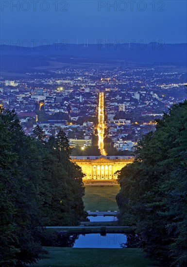 Bergpark Wilhelmshoehe with the view over the central park axis to Kassel in the blue hour