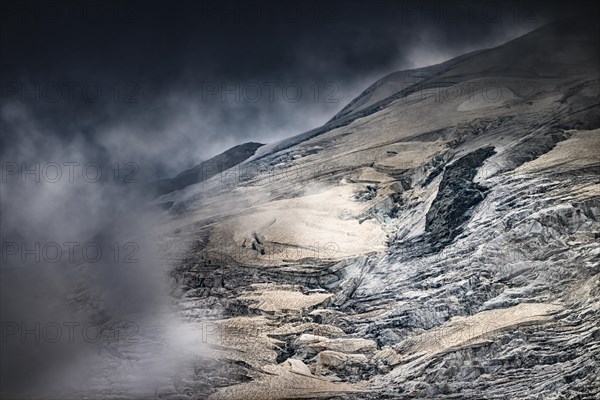 Bernina Group with Rosegg Glacier and dramatic clouds at blue hour