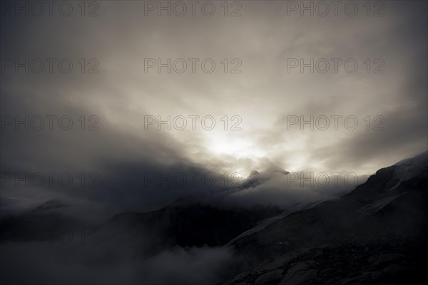 Bernina Group with Rosegg Glacier and dramatic clouds at blue hour