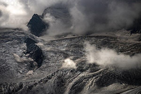 Bernina Group with Rosegg Glacier and dramatic clouds at blue hour