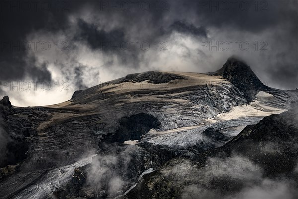 Bernina Group with Rosegg Glacier and dramatic clouds at blue hour