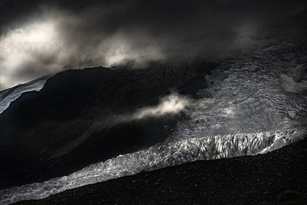 Bernina Group with Rosegg Glacier and dramatic clouds at blue hour