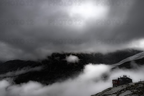 Chamanna Coaz mountain hut above the Val Rosegg valley at blue hour