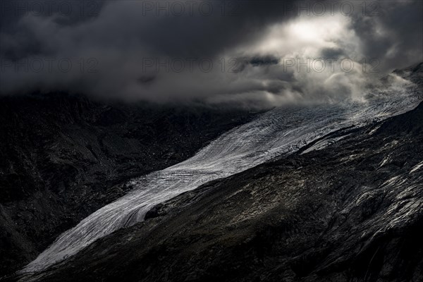 Bernina Group with Rosegg Glacier and dramatic clouds at blue hour