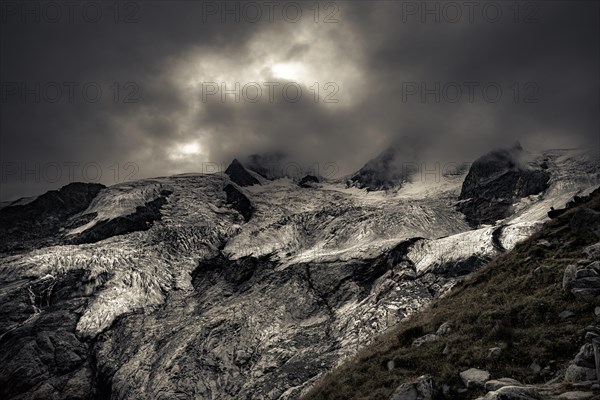 Bernina Group with Rosegg Glacier and dramatic clouds at blue hour