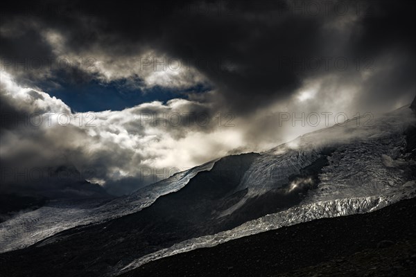 Bernina Group with Rosegg Glacier and dramatic clouds at blue hour