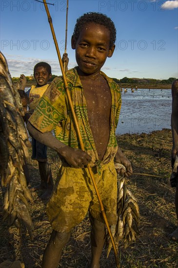 Young boys with their fresh caught fish