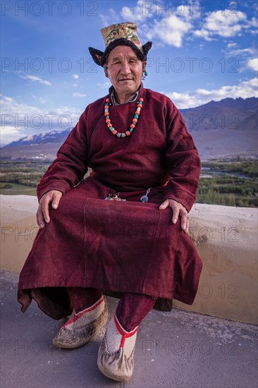 Elderly man in traditional Ladakhi clothes