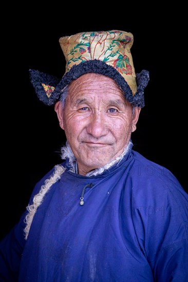 Elderly man in traditional Ladakhi clothes