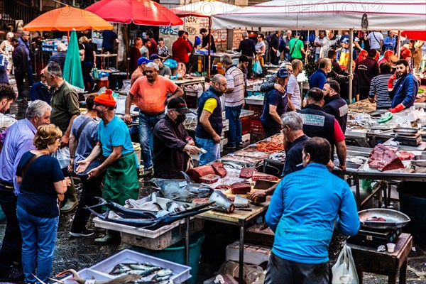 Historic fish market La pescheria with a cornucopia of colourful sea creatures