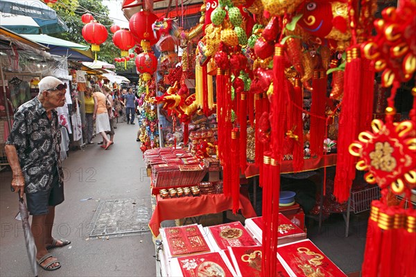 Red lamps and pendants in a market alley