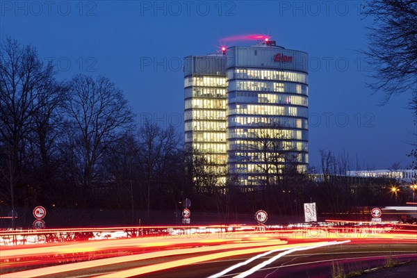 Light trails on the A 52 motorway and the E.ON SE corporate headquarters in the evening