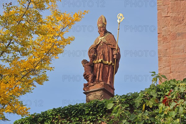 Patron Saint St. Martin with crook and mitre at the church of St. Martin