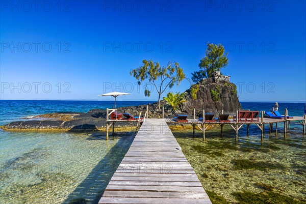 Pier to little islet on the coastline of the Island Ile Sainte Marie