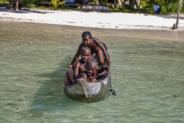 Young boys in a canoe