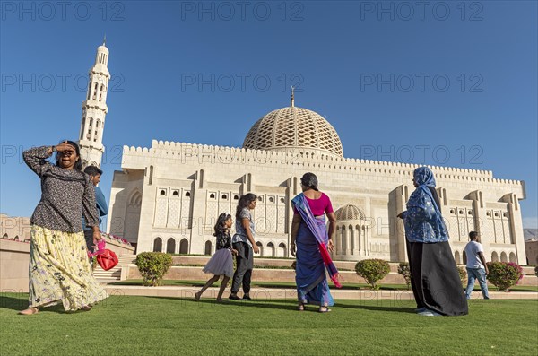 Indian family visiting Sultan Qaboos Grand Mosque