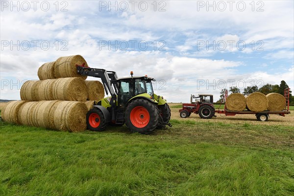 Tractor with bale fork stacking round bales
