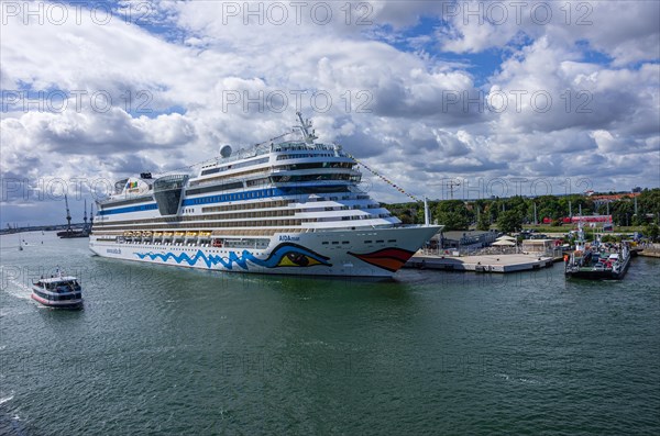 The cruise ship AIDAmar at the quay wall of the Warnemuende Cruise Center in the port of Rostock-Warnemuende