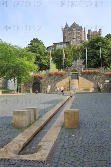 View of Klopp Castle from Mayor Franz Neff Square with fountain and water feature with water channel