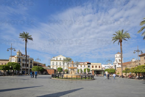 Plaza de Espana with ornamental fountain and palm trees in Merida