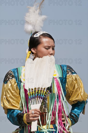 Female dancer in jingle dance regalia