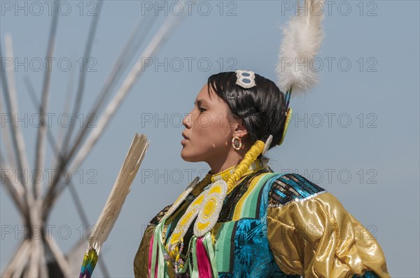 Female dancer in jingle dance regalia