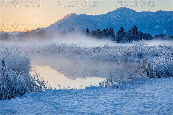 Snowy winter landscape with the Uffinger Ach at dawn with Herzogstand 1731m and Heimgarten 1790m