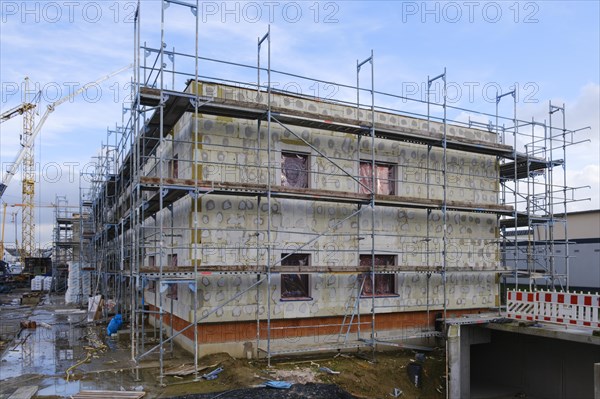 Shell of a residential building with scaffolding