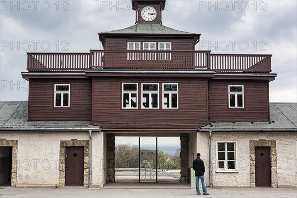 Visitors at the gate to the camp