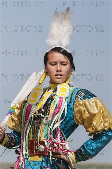 Female dancer in jingle dance regalia