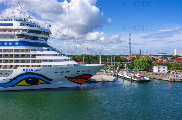 The cruise ship AIDAmar at the quay wall of the Warnemuende Cruise Center in the port of Rostock-Warnemuende