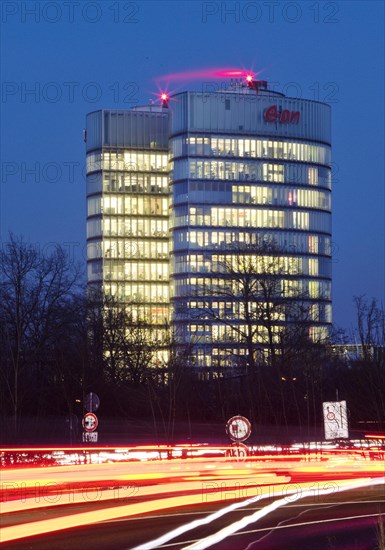 Light trails on the A 52 motorway and the E.ON SE corporate headquarters in the evening