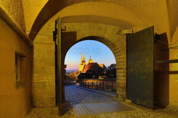 View through the Peterstor of the Petersberg Citadel of the Severi Church and Erfurt Cathedral at dawn