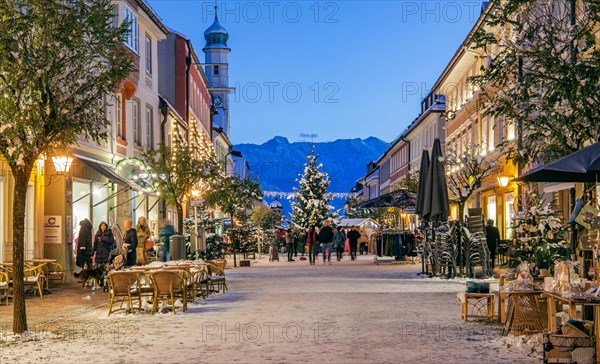 Winter Obermarkt in the snow with Christmas tree and Christmas lights in front of the Hoehen Kiste 1922m in the Estergebirge