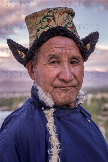 Elderly man in traditional Ladakhi clothes