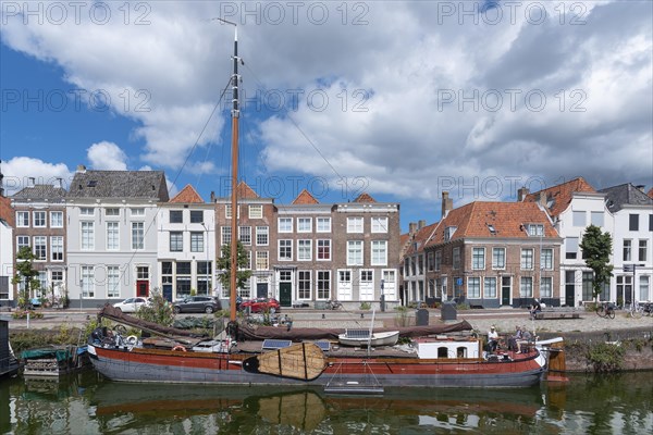 Townscape with traditional flat-bottomed sailing boat at Bierkaai