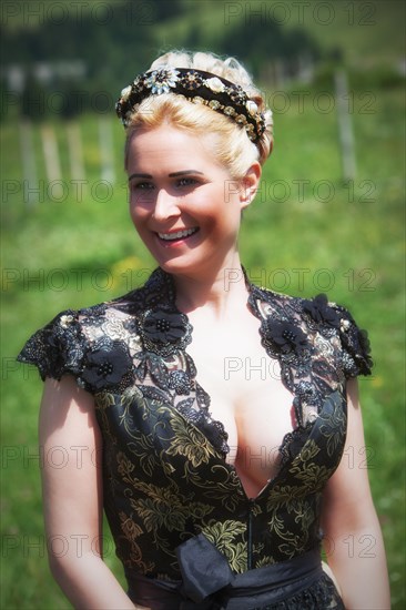 Portrait of a Blonde Woman in a Dirndl with Black Lace