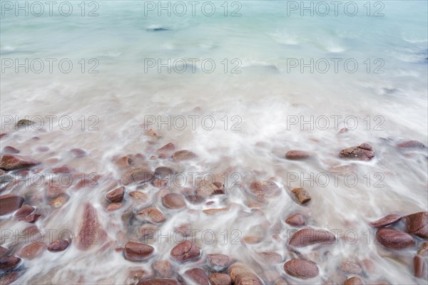 Detail of the swell on a sand and stone beach on the north-west coast of Scotland