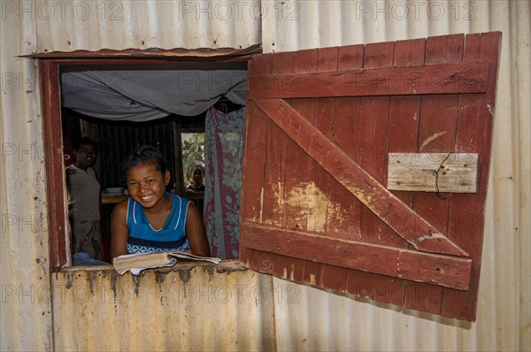 Girl studying in a little hut
