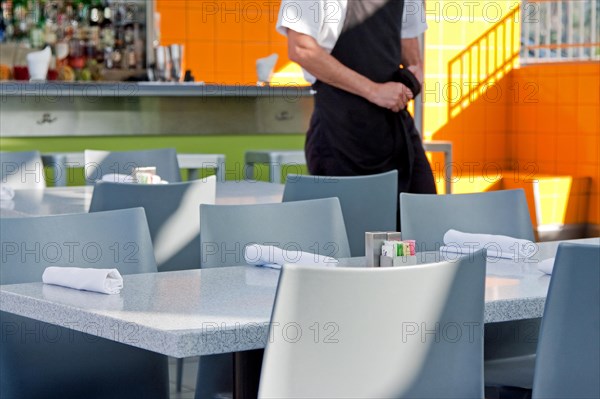 Waiter in an empty restaurant