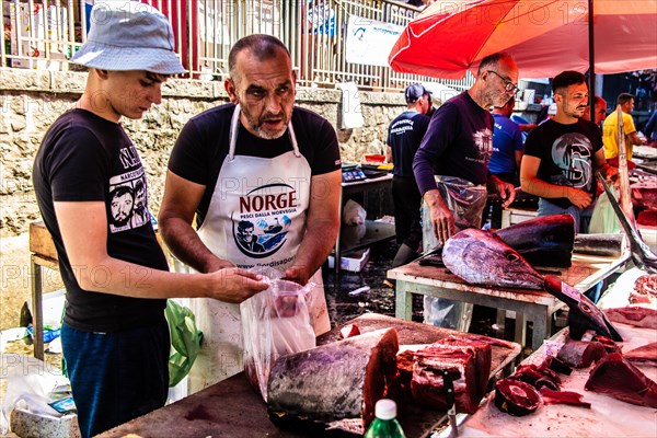 Historic fish market La pescheria with a cornucopia of colourful sea creatures