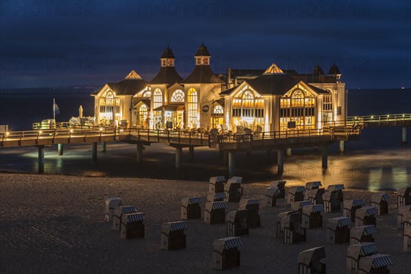 Pier and beach chairs on the beach of Sellin