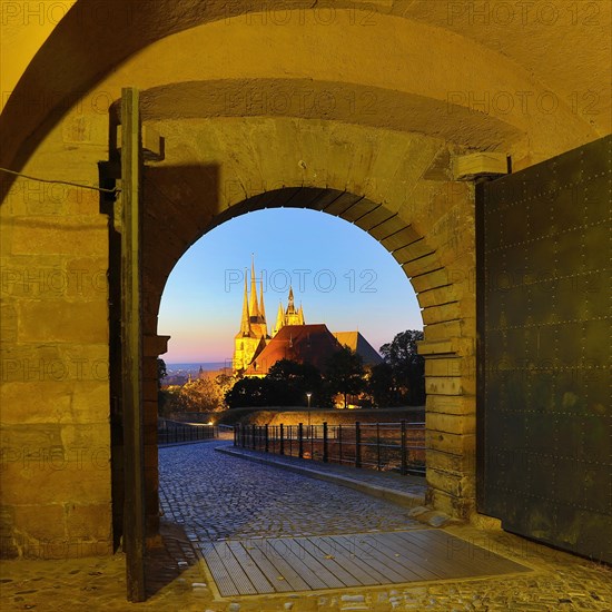 View through the Peterstor of the Petersberg Citadel of the Severi Church and Erfurt Cathedral at dawn