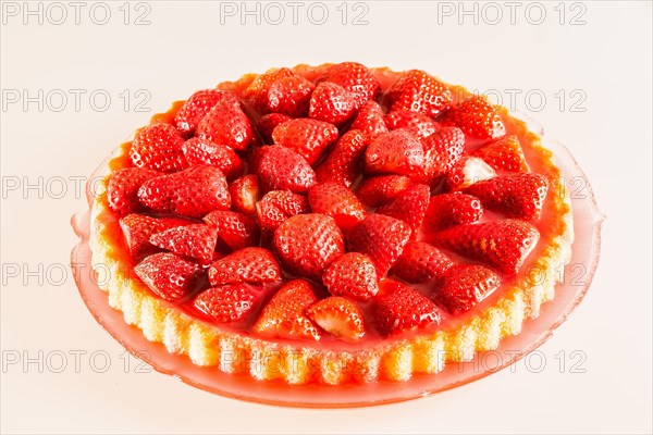 Fresh strawberry cake on a glass cake plate