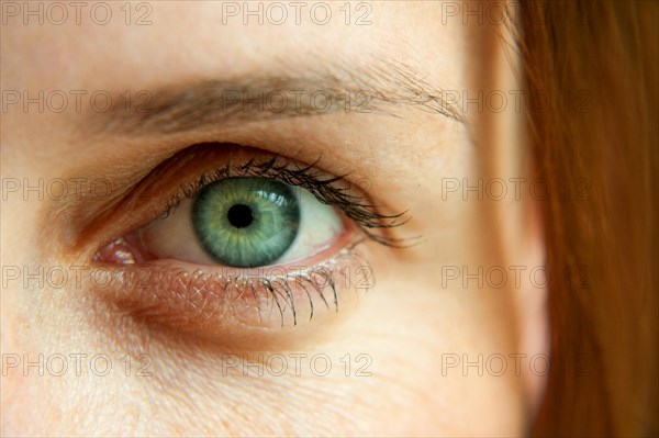 Womans left green eye