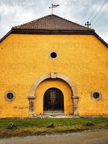 Yellow-painted farm building