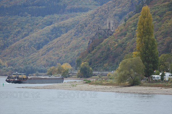 Rhine valley with cargo ship and Rheinstein Castle