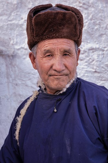 Elderly man in traditional Ladakhi clothes