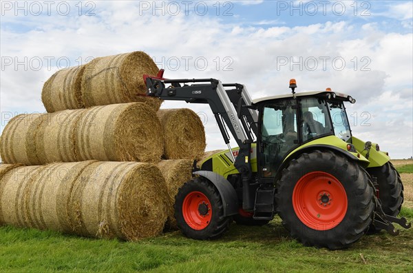 Tractor with bale fork stacking round bales